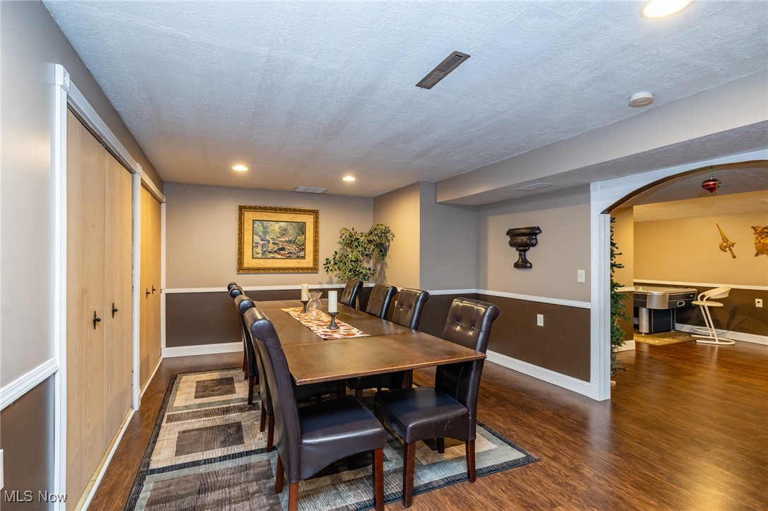 12181 Williams Road Homerville, OH 44235 - Photo 33 of 49 Dining room with dark hardwood / wood-style floors and a textured ceiling