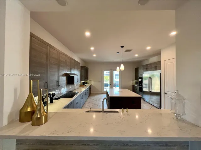 a en suite bathroom with a tub sink and mirror