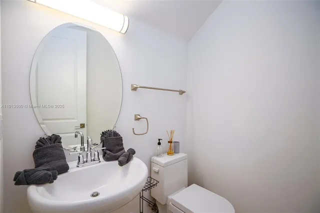 a bathroom with a double vanity sink mirror and double