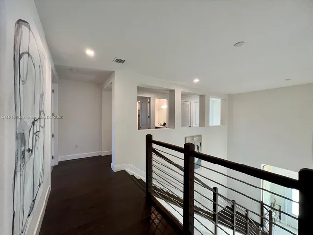 a bedroom with bed and a window