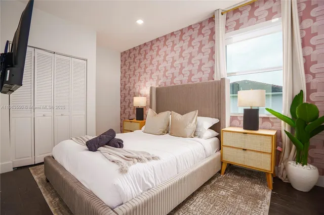 a bedroom with a bed and window