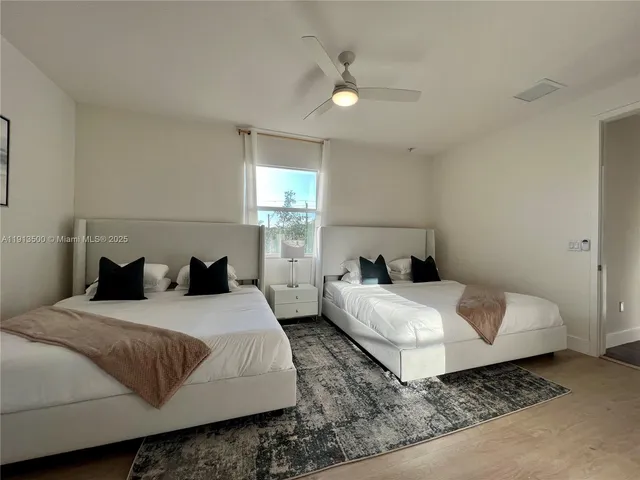 a view of a swimming pool with chairs and a table