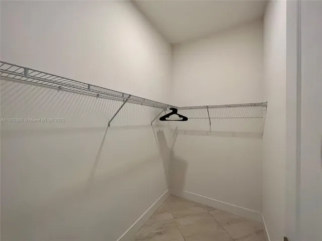 a view of a house with backyard porch and sitting area