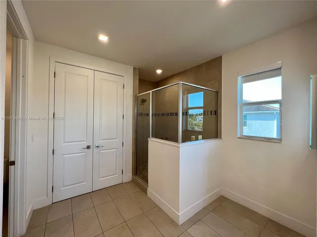 a view of a backyard with swimming pool