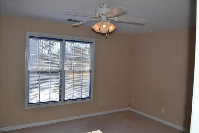 an empty room that has a window
