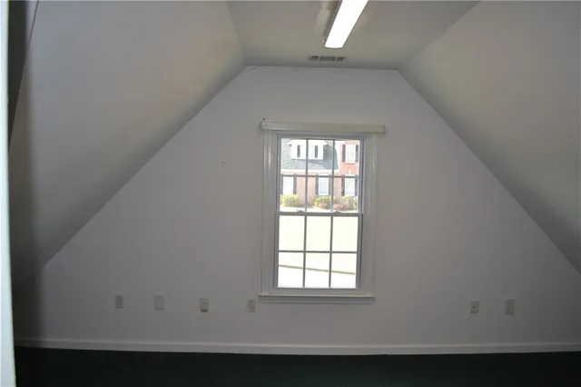 a balcony with wooden floor