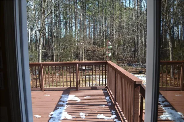 a balcony with wooden floor