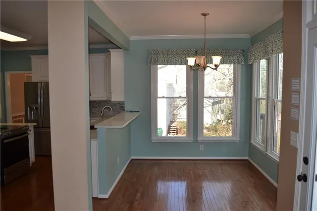 a kitchen with a window a sink and a refrigerator