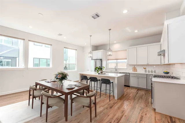 a kitchen with a table and chairs in it