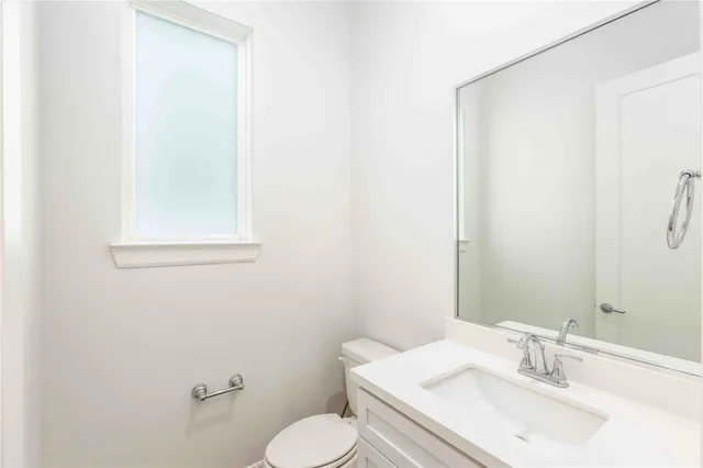 a bedroom with a large bed and a large window