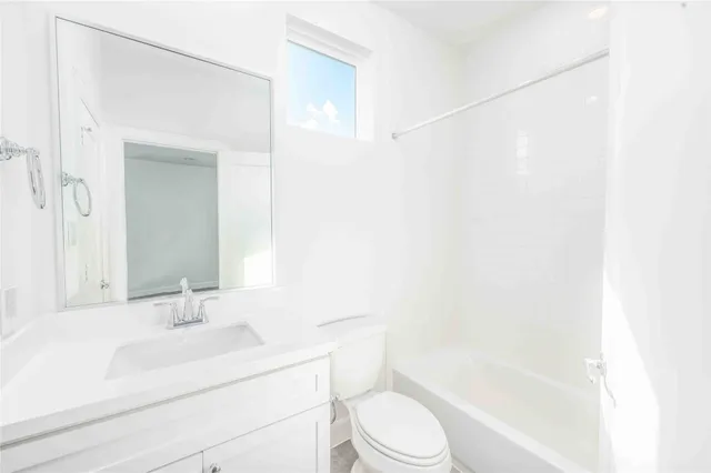 a bedroom with bed and a window