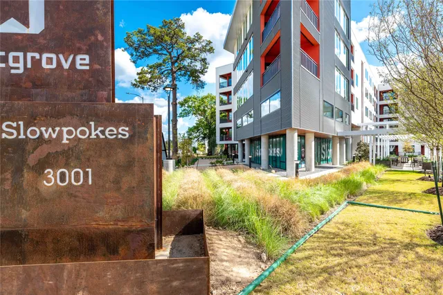 a view of a swimming pool with a bench in patio