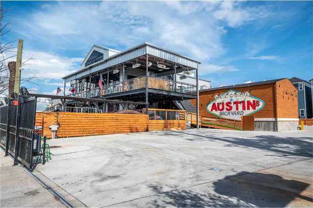 a front view of a building with parking space