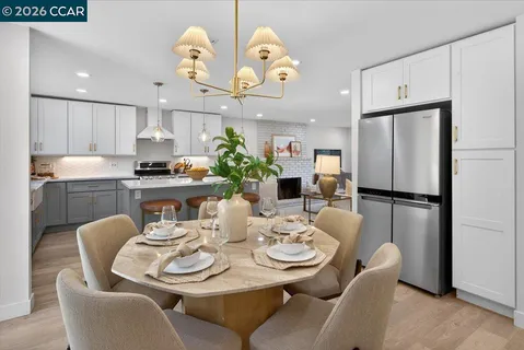 a dining room with furniture a window and kitchen view