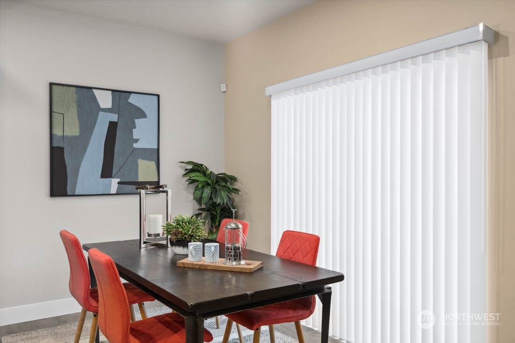 4011 171st Place Southeast Bothell, WA 98012 - Photo 12 of 33 a view of a dining room with furniture and wooden floor