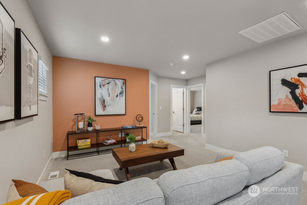 4011 171st Place Southeast Bothell, WA 98012 - Photo 15 of 33 a living room with furniture and a large window