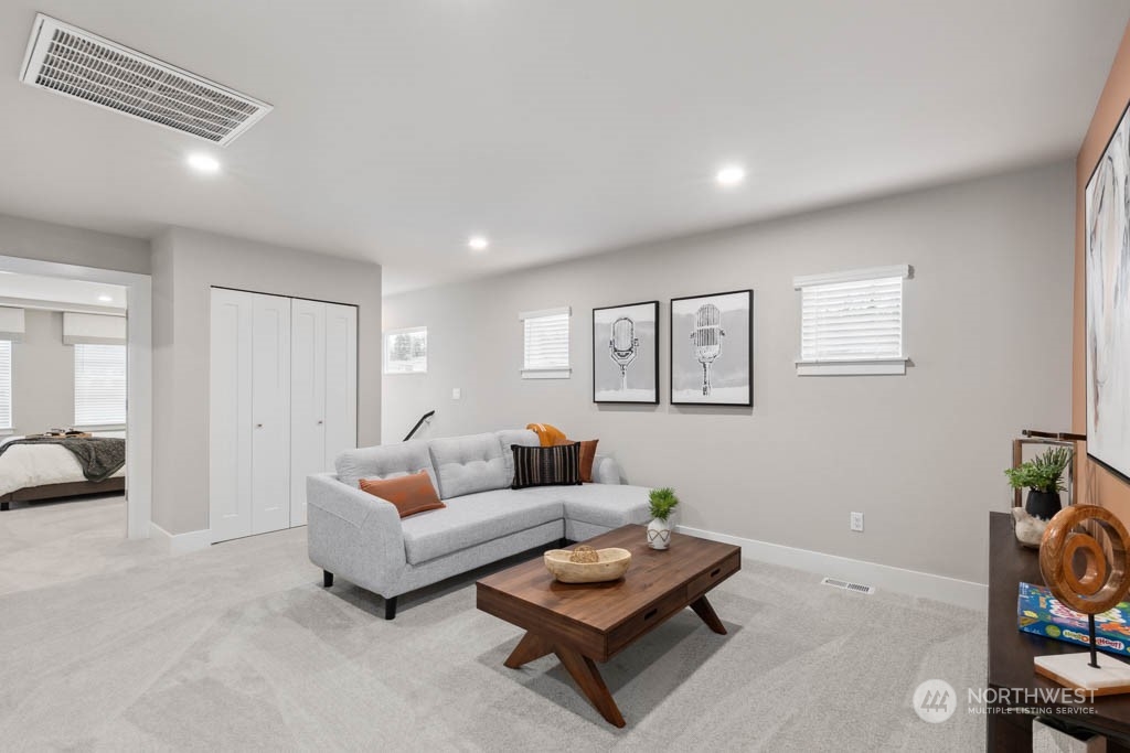 4011 171st Place Southeast Bothell, WA 98012 - Photo 16 of 33 a living room with furniture and a wooden floor