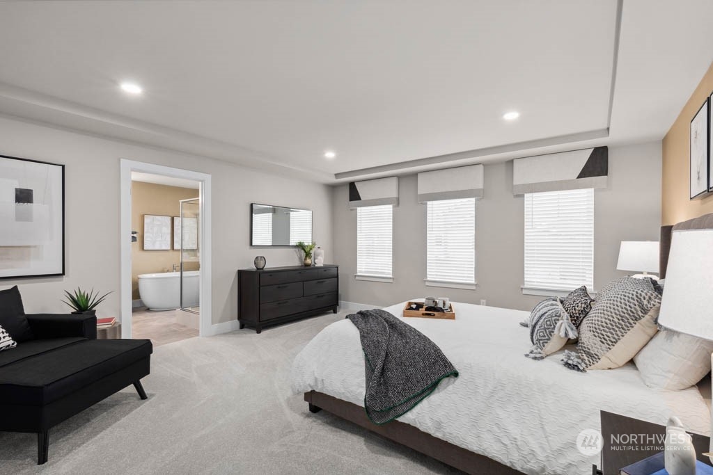 4011 171st Place Southeast Bothell, WA 98012 - Photo 19 of 33 a spacious bedroom with a bed and couch