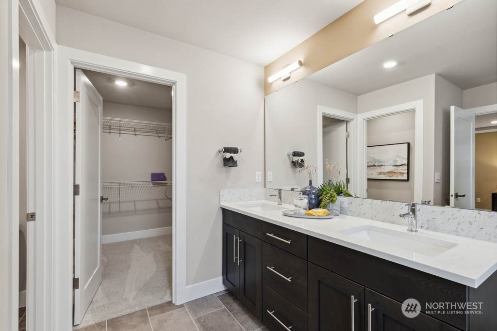 4011 171st Place Southeast Bothell, WA 98012 - Photo 20 of 33 a bathroom with a sink double vanity and a shower