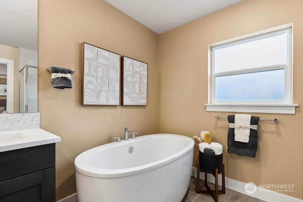 4011 171st Place Southeast Bothell, WA 98012 - Photo 23 of 33 a white bath tub sitting next to a white sink