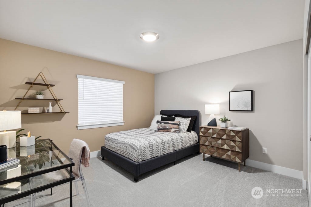 4011 171st Place Southeast Bothell, WA 98012 - Photo 26 of 33 a bedroom with a bed and a window