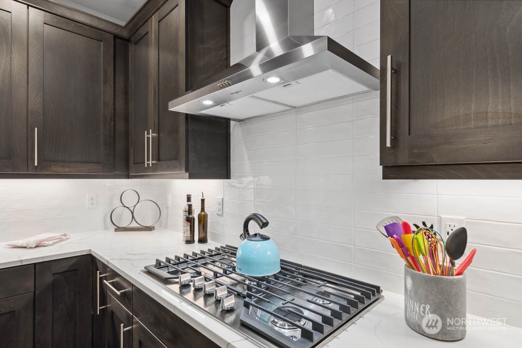 4011 171st Place Southeast Bothell, WA 98012 - Photo 7 of 33 a kitchen with a stove and cabinets