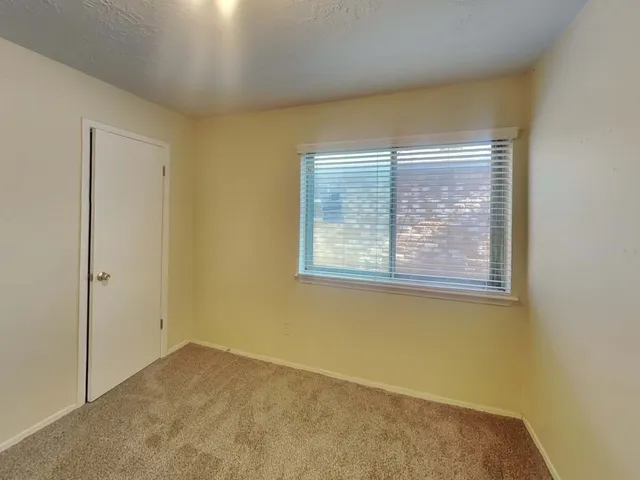 a bathroom with sink granite and a mirror