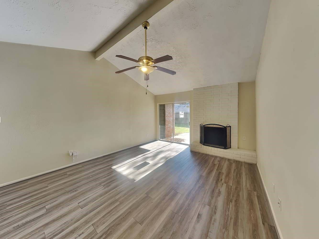 4434 Algernon Drive Spring, TX 77373 - Photo 2 of 17 a view of empty room with wooden floor and fireplace