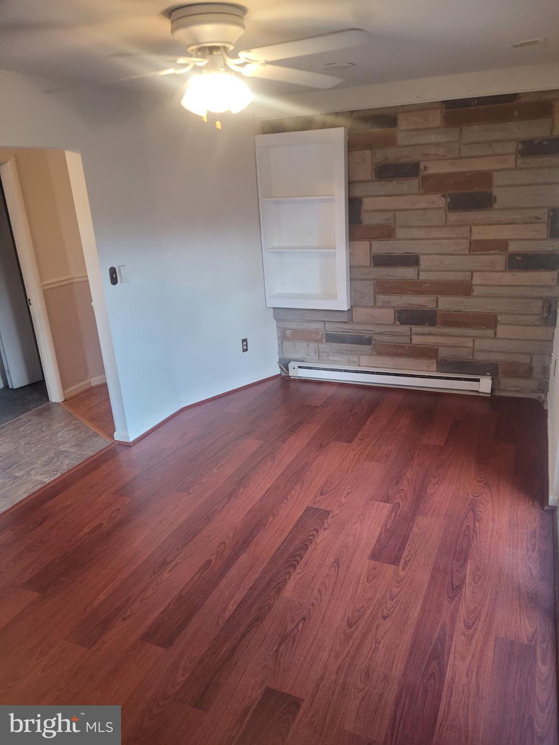 10926 Riverview Road Fort Washington, MD 20744 - Photo 11 of 15 a view of empty room with wooden floor and fan