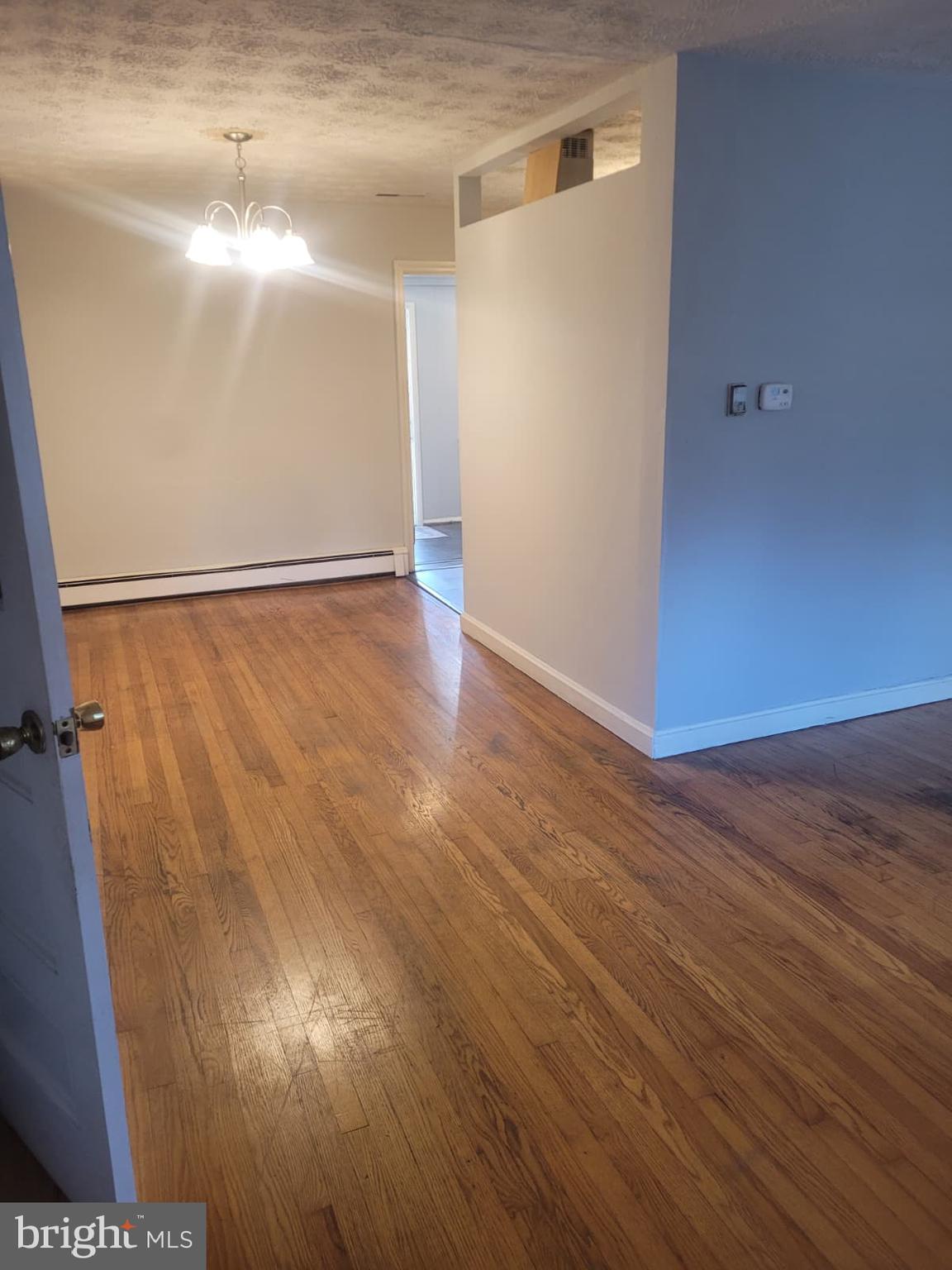 10926 Riverview Road Fort Washington, MD 20744 - Photo 14 of 15 a view of an empty room with wooden floor and a window