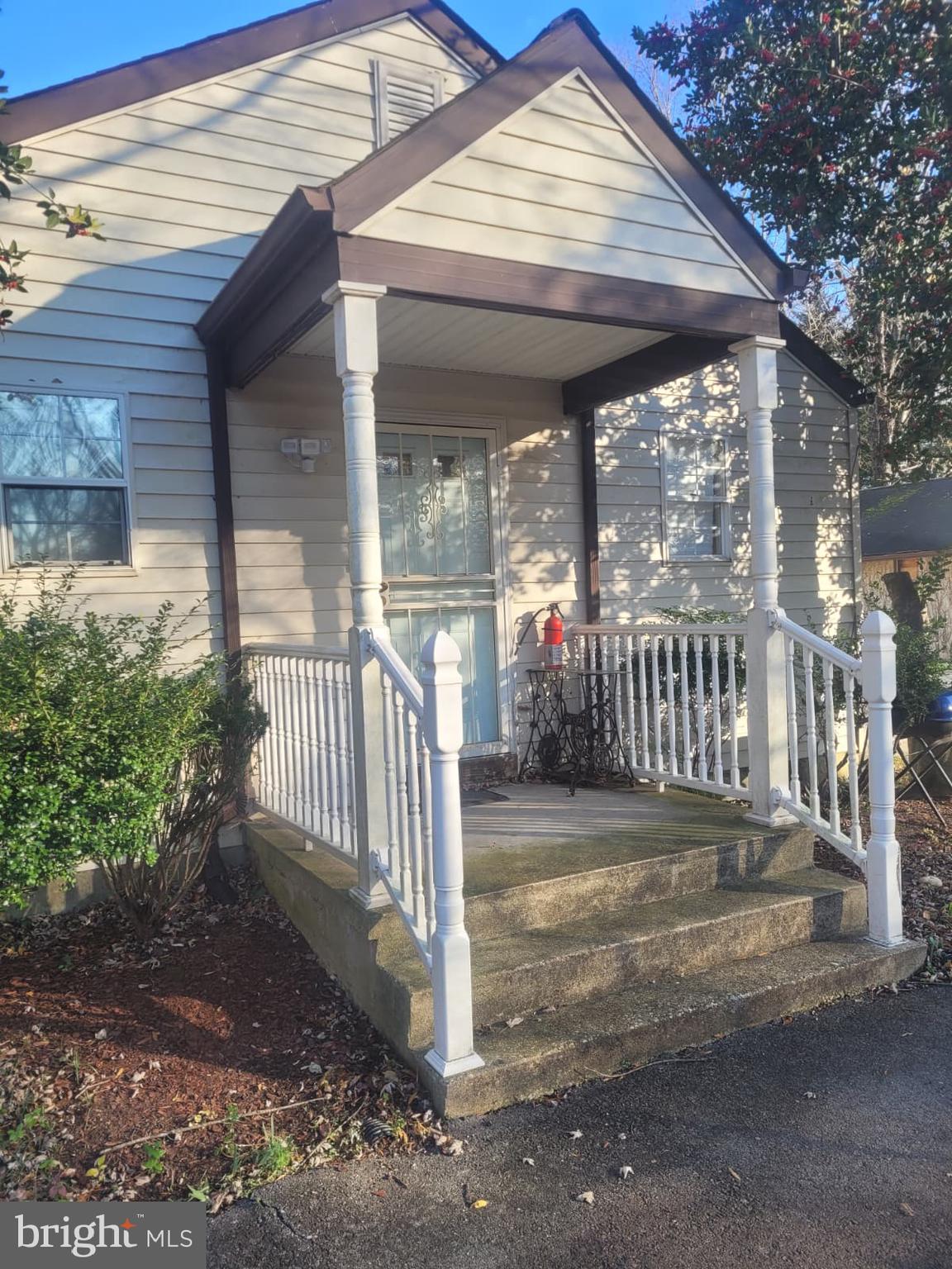 10926 Riverview Road Fort Washington, MD 20744 - Photo 2 of 15 a view of a patio with a table and chairs