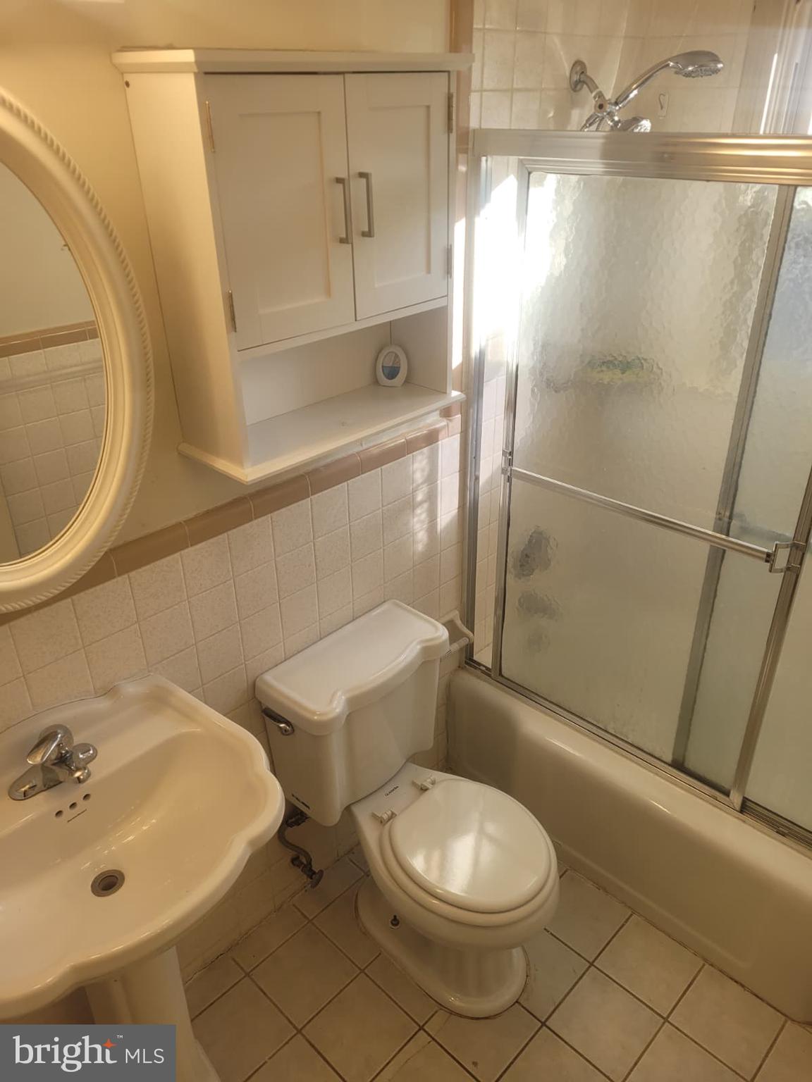 10926 Riverview Road Fort Washington, MD 20744 - Photo 9 of 15 a bathroom with a sink a toilet and shower