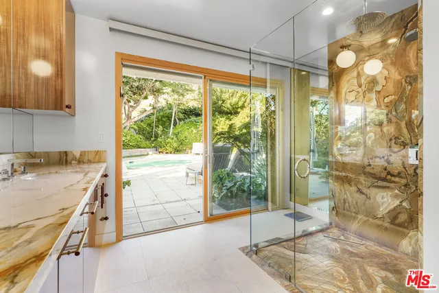 a bathroom with a sink and a shower