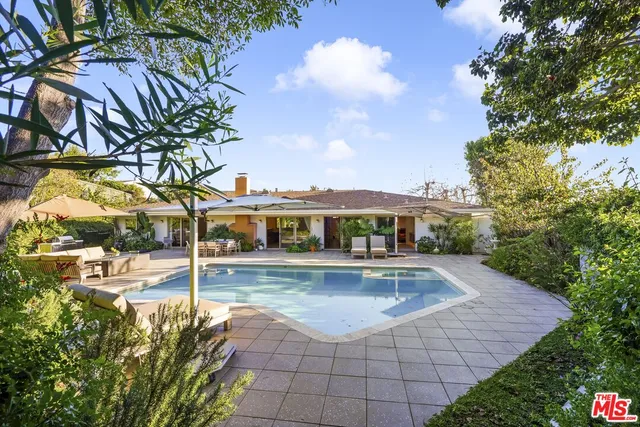 a view of a swimming pool with a patio