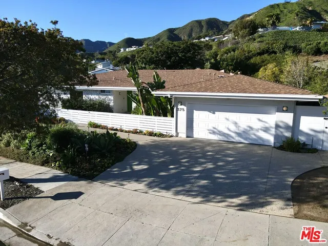 a view of a house with a street