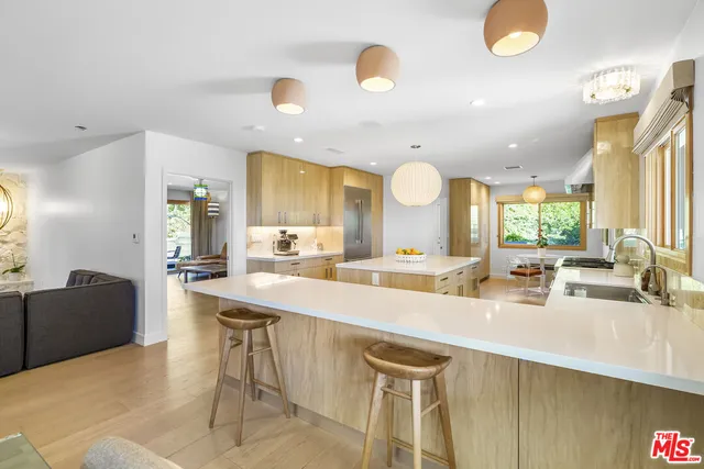 a kitchen with a sink cabinets and window