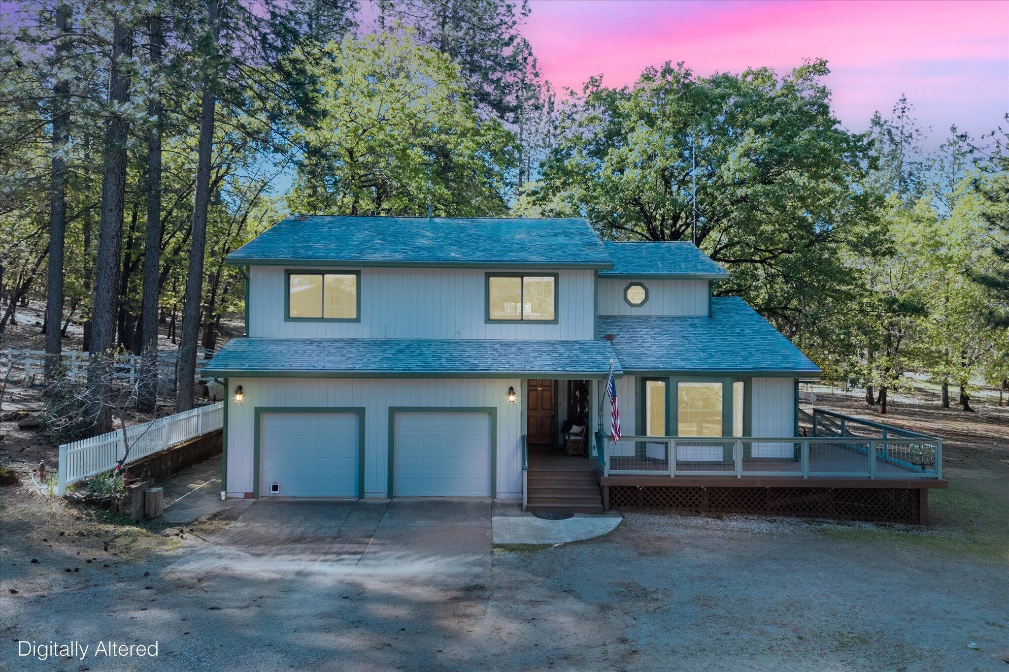 26997 Lookout Mountain Road Oak Run, CA 96069 - Photo 1 of 92 a front view of a house with a garden and tree