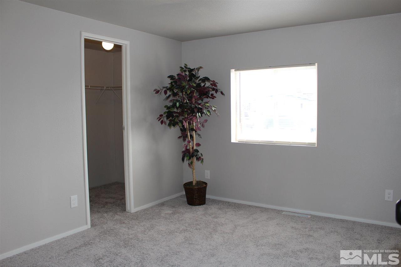 5189 Coggins Road Reno, NV 89506 - Photo 25 of 33 a view of empty room with a window and a potted plant