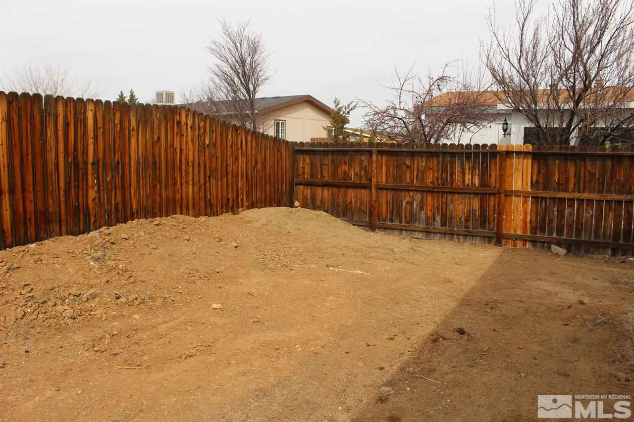 5189 Coggins Road Reno, NV 89506 - Photo 31 of 33 a view of backyard and wooden fence