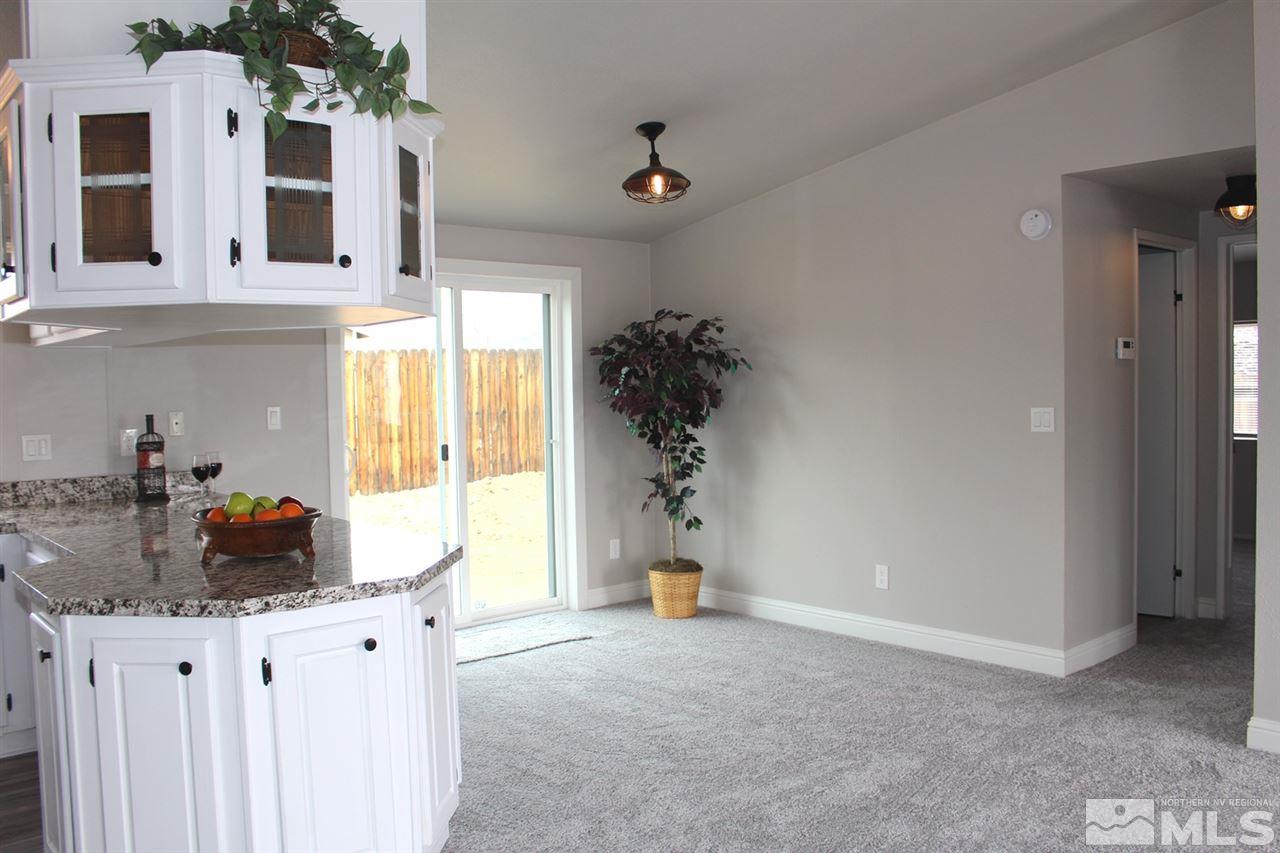 5189 Coggins Road Reno, NV 89506 - Photo 5 of 33 a kitchen with a sink cabinets and a window