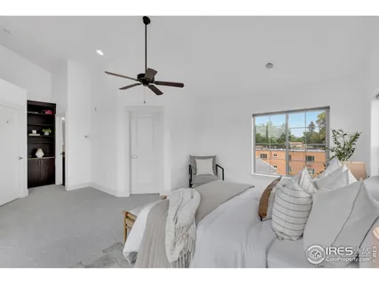 a bedroom with furniture and a window