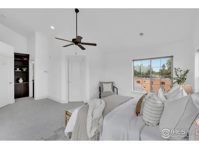 a bedroom with furniture and a window