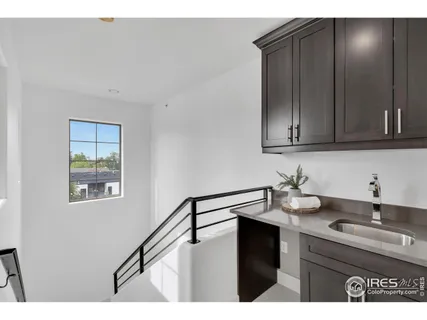 a kitchen with a sink cabinets and window