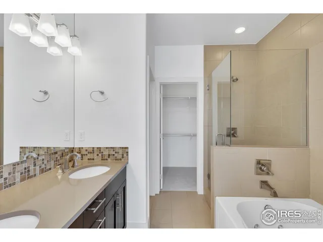 a bathroom with a sink a mirror and a bathtub