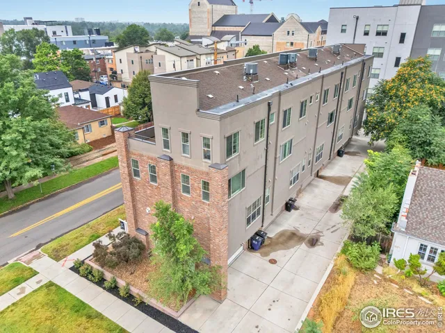 a view of buildings with yard