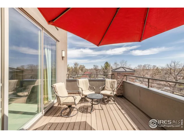 a view of balcony with furniture