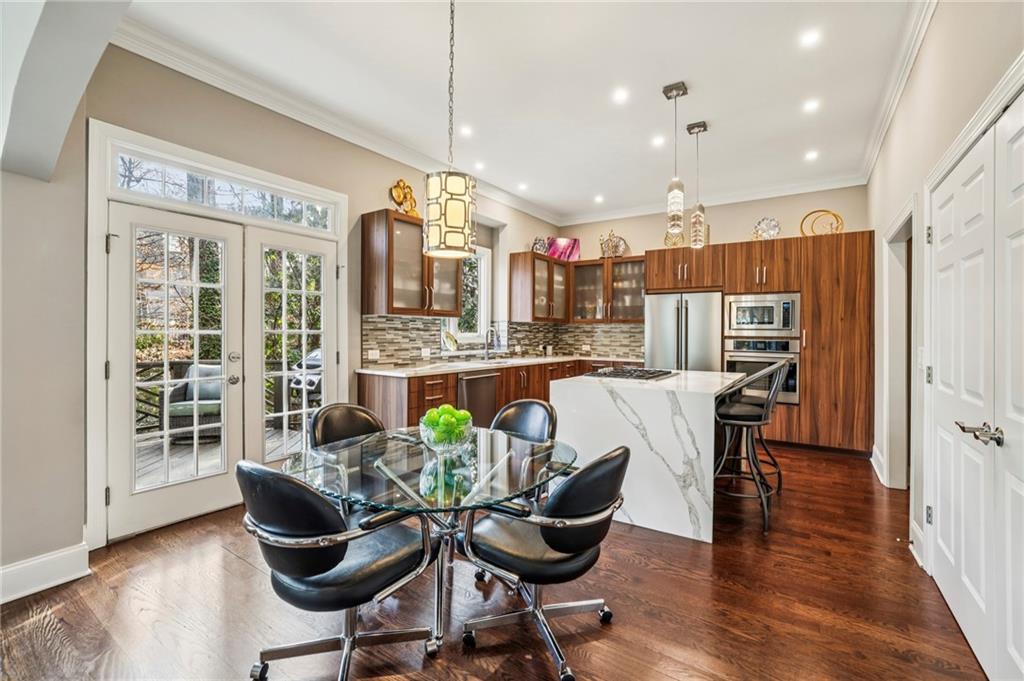 3519 High Grove Way Atlanta, GA 30319 - Photo 13 of 38 a view of a dining room with furniture window and wooden floor