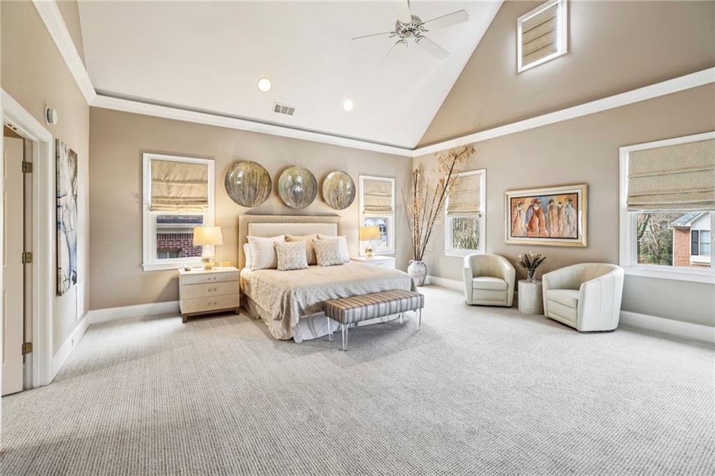 3519 High Grove Way Atlanta, GA 30319 - Photo 17 of 38 a spacious bedroom with a bed and cabinet