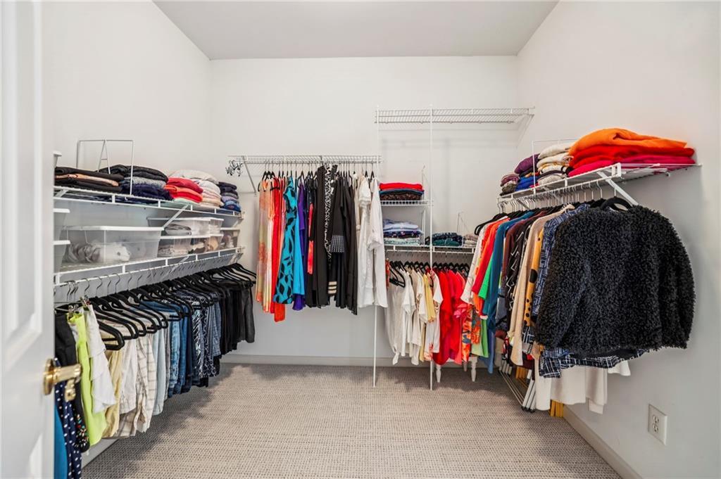 3519 High Grove Way Atlanta, GA 30319 - Photo 22 of 38 a view of walk in closet with clothes and shoes