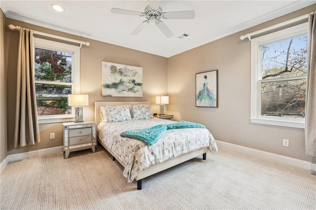 3519 High Grove Way Atlanta, GA 30319 - Photo 25 of 38 a spacious bedroom with a large bed and a window